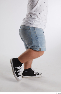 Jerome  1 black sneakers blue shorts dressed flexing leg…